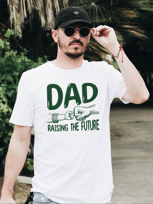 Father's day t-shirt that says Dad Raising the Future in green font with image of dad and child fist bump