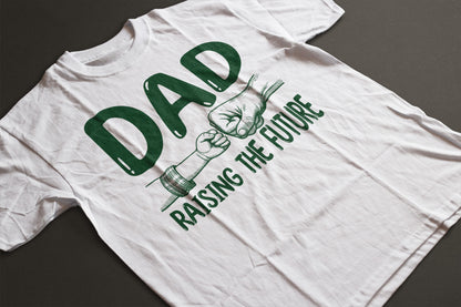 Special gift for dad, t-shirt that says Dad Raising the Future in green font with image of dad and child fist bump.